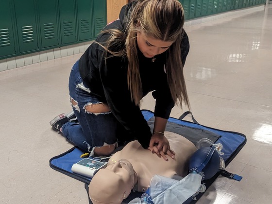 Student performing CPR