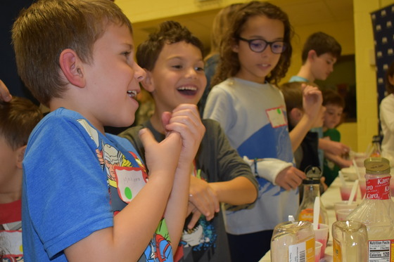 image of students learning at STEAM family night