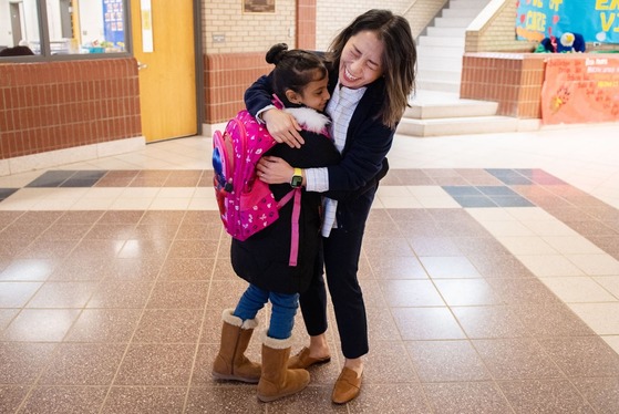 principal hugs student