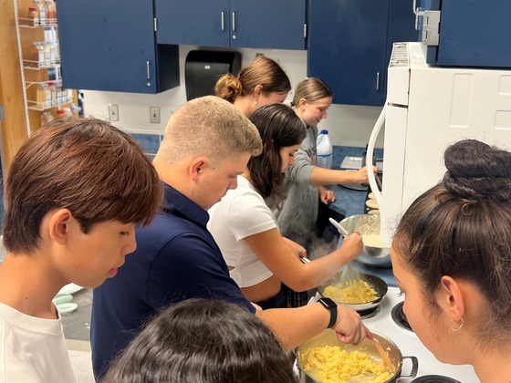 Leadership Students Making Breakfast for Staff