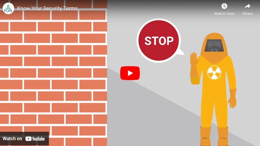 Person wearing hazmat suit with hand up saying "Stop"