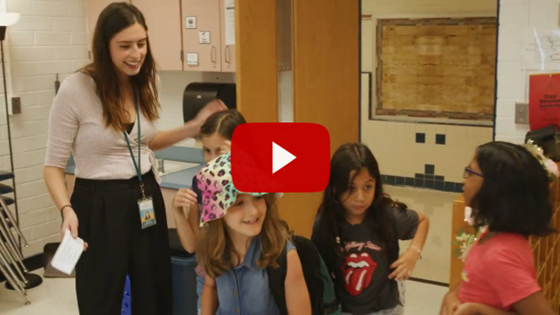 First year teacher, Ms. Vivi, with her elementary students