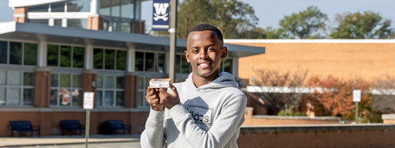 student holding soap