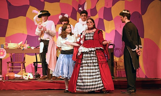 students on stage performing play