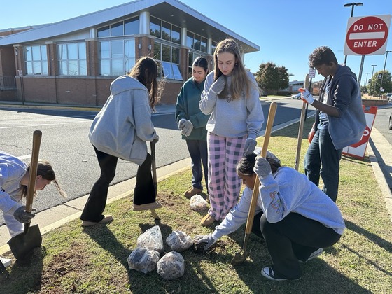 Environmental Club planting daffodil bulbs