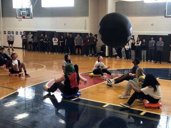 PE classes playing Omnikin Scooter