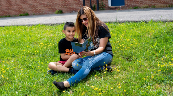 adult reading a book to child
