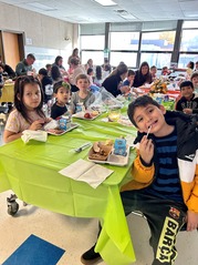 families enjoying Thanksgiving Lunch