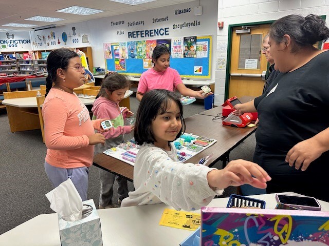 Students shopping at the school book fair