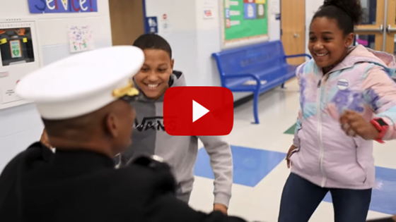 Students running to military father