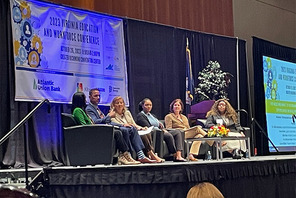 Five panelists and a moderator on stage at the Virginia Education and Workforce Conference