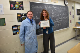 Picture of Jonathan Osborne receiving Teacher of the Year honor