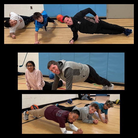 5th graders and teachers worked on planking during PE.