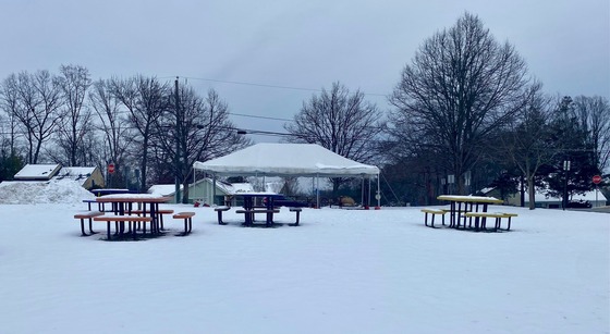 snow covered tables and tent