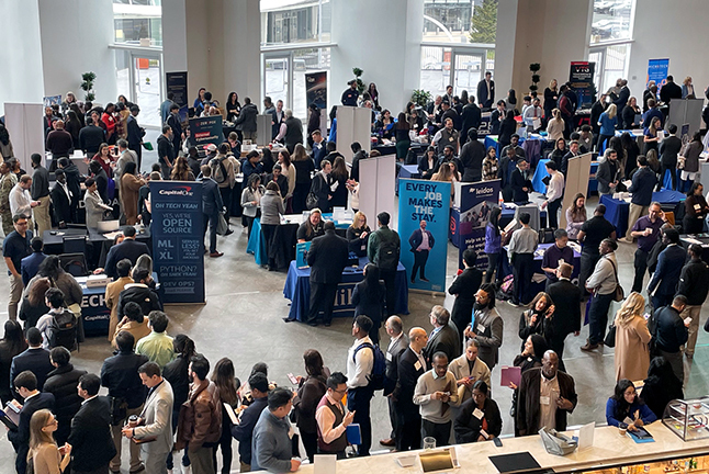 2024 Tech and Cyber Networking and Hiring Fair - Wide shot from above with a lot of participants.