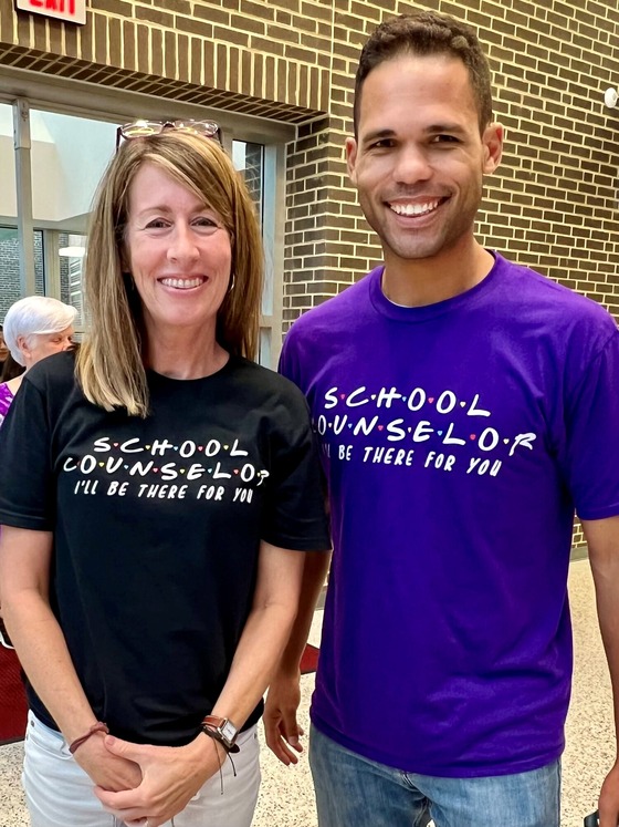 An image of counselors Paula Treger and Joseph Gayl with shirts that say "School Counselors, I'll be there for you!" 