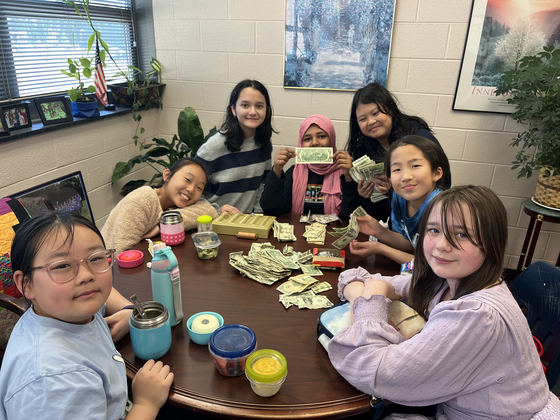 students with fundraiser money 