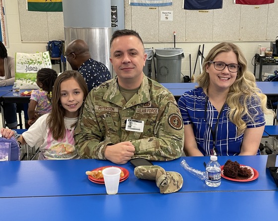 Military parents and students at muffin breakfast
