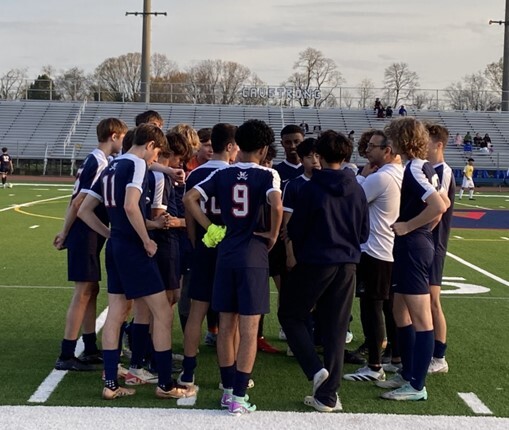 JV Soccer Team strategizing before the game 