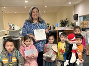 Marcia Reading to Kids at All Ages Read Together Event March 2024