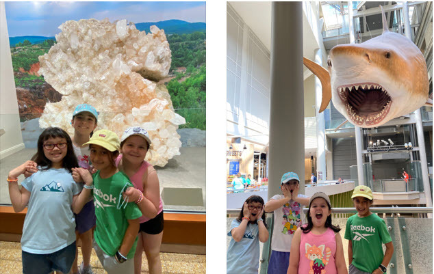 3rd graders in front of a huge crystal and in front of a huge shark at the Natural History Museum