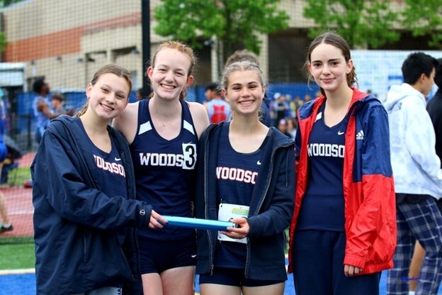 Track athletes pose for picture at meet