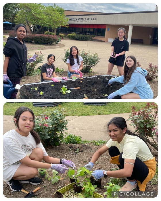 Students gardening in front of the school building