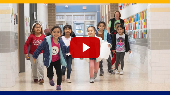 Students walking together in school hallway