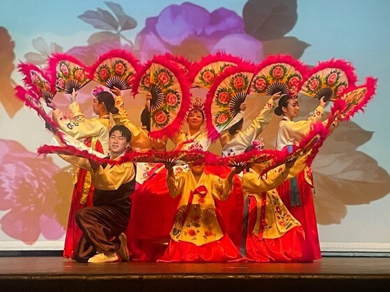 Students wearing Korean clothing performing Korean dance