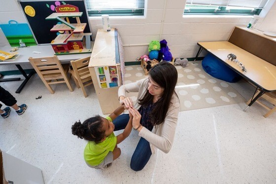 Occupational therapist working with toddler