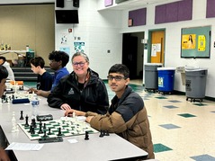Dr. Reid and student at chess tournament