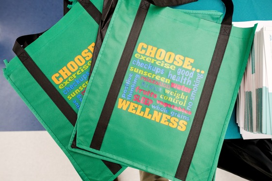 photo of canvas bags with wellness messages