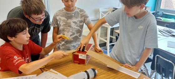 Sixth graders design blades for a wind turbine.