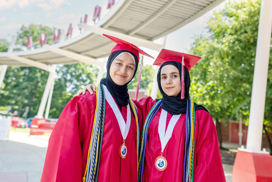 Two students in cap and gown