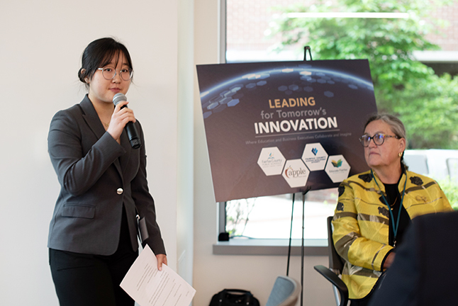 Woodson High School graduate Tiffany Park speaking at the Leading for Tomorrow's Innovation Event.  
