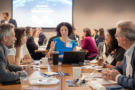 C-Suite executives discussing the future of K-12 education in FCPS during facilitated table discussions.