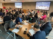 Leading for Tomorrow's Innovation event.  Wide shot with tables full of c-suite leaders.