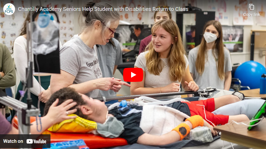 Students discussing medical bed with mother and disabled student