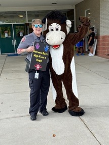 Our Community Outreach Officer, Meg Hawkins, and Charger the Bull welcoming our students back to school!