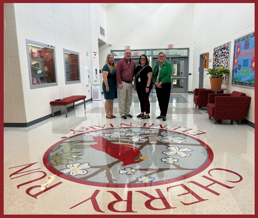 School Board Member Sandy Anderson and Superintendent Dr. Michelle Reid with Cherry Run administration