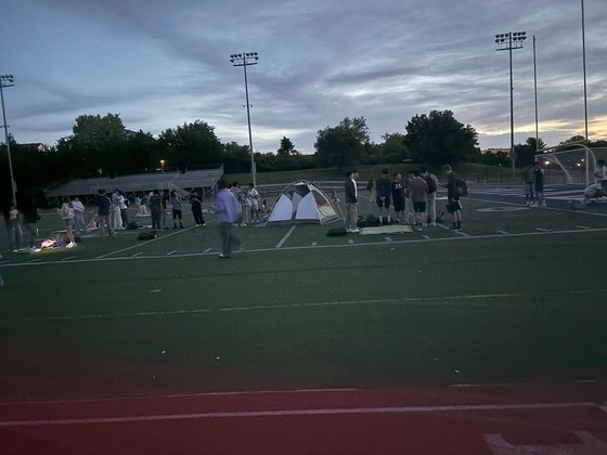 Seniors set up tents on stadium field to watch sunrise