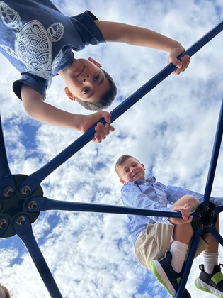 Two children climbing on the super dome