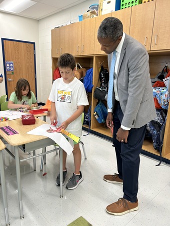 Dr. Stokes looking at a student's work.