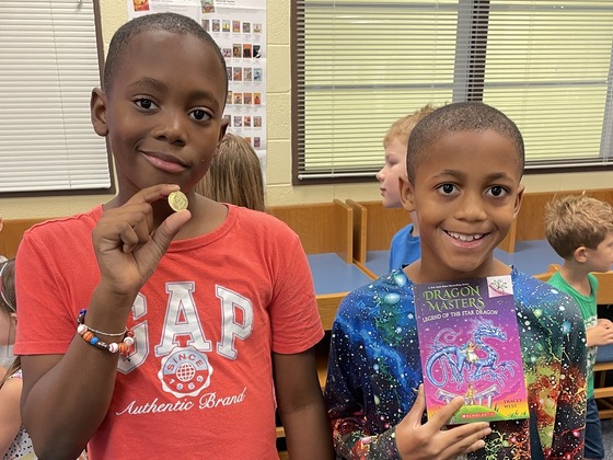 students getting their birthday books from the new book vending machine