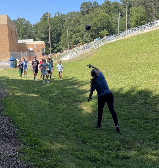 Mrs. Conforti Throwing a Football