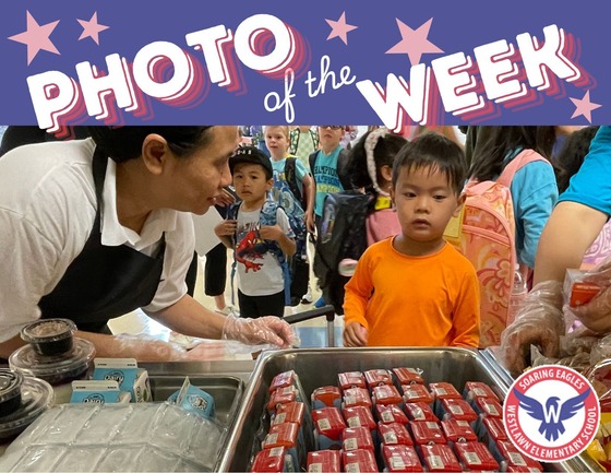 Photo of the Week: a child choosing breakfast options from a cart