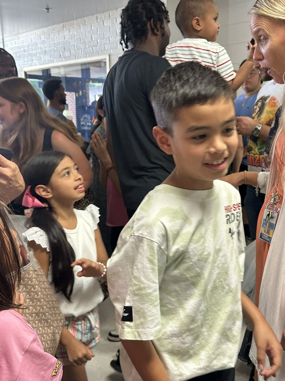 Photo of families arriving at open house