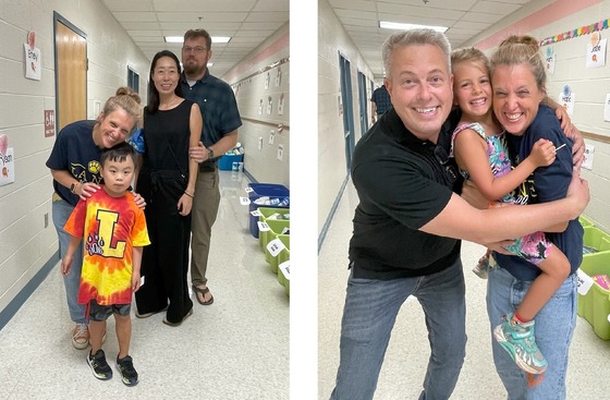 Two families celebrating with a teacher