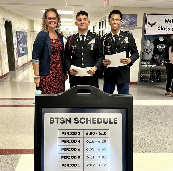 Ms. Burke with 2 JROTC students