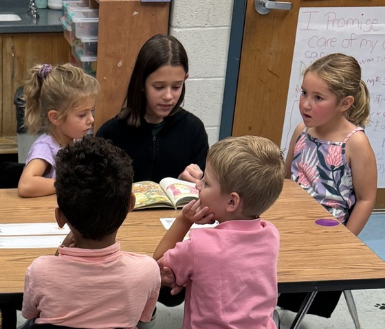 5th graders reading to kindergarteners